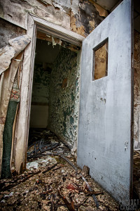 Cell Featuring double locks and a mirror mounted in the top corner of the room
